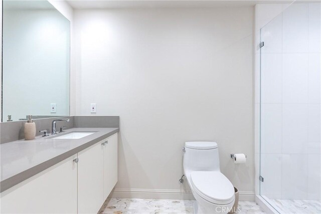 bathroom with toilet, vanity, and an enclosed shower