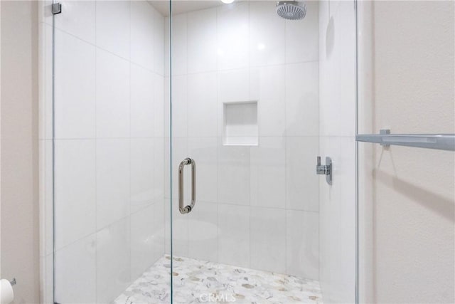 bathroom featuring walk in shower