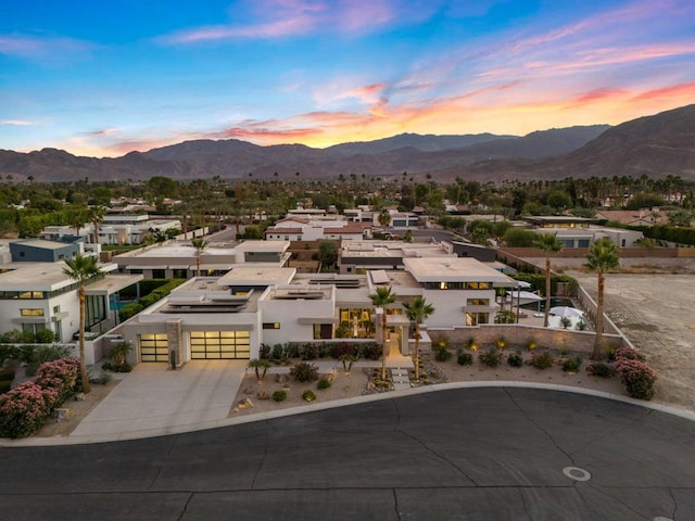 aerial view at dusk with a mountain view