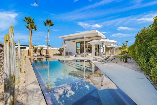 view of swimming pool featuring a patio