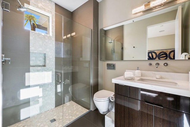 bathroom with vanity, an enclosed shower, and toilet