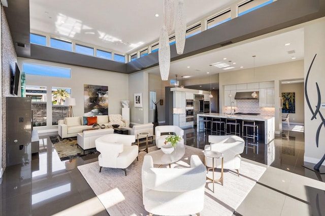 tiled living room with a high ceiling