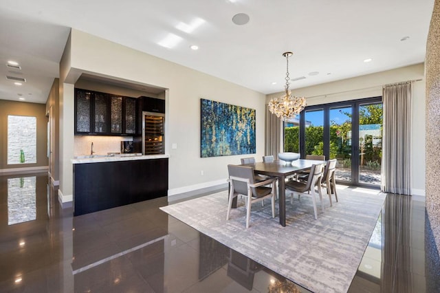 tiled dining area with a notable chandelier and french doors