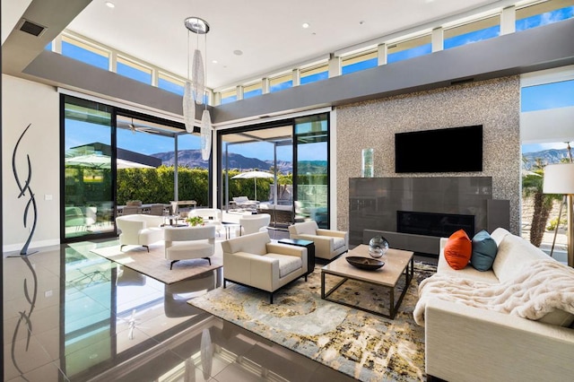 living room with a healthy amount of sunlight and tile patterned floors