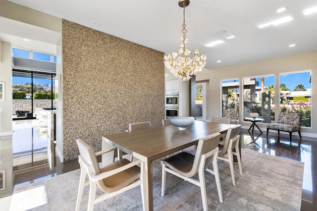 dining area with an inviting chandelier