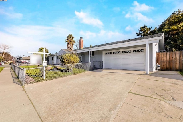 ranch-style house with a garage and a front yard