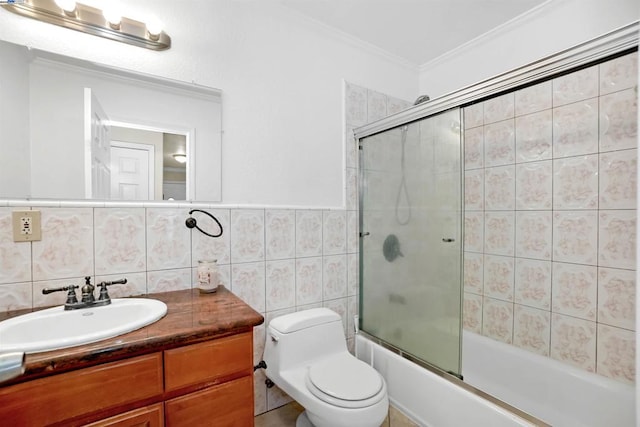 full bathroom featuring vanity, decorative backsplash, tile walls, toilet, and combined bath / shower with glass door