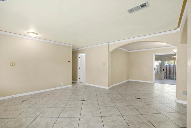 tiled spare room with ornamental molding