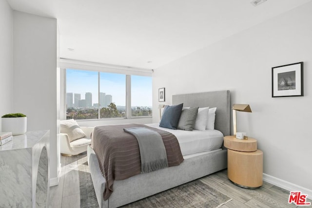 bedroom with light hardwood / wood-style flooring