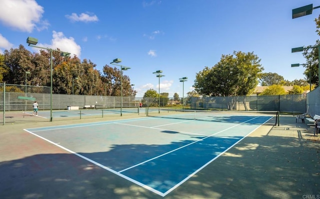 view of sport court with basketball hoop