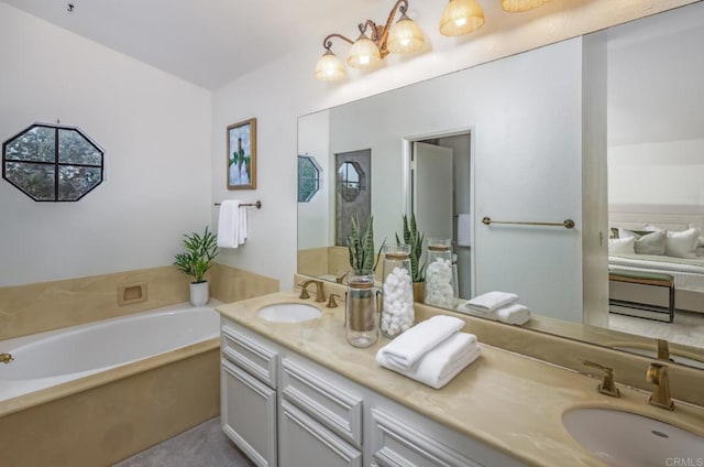 bathroom with vanity and a bath