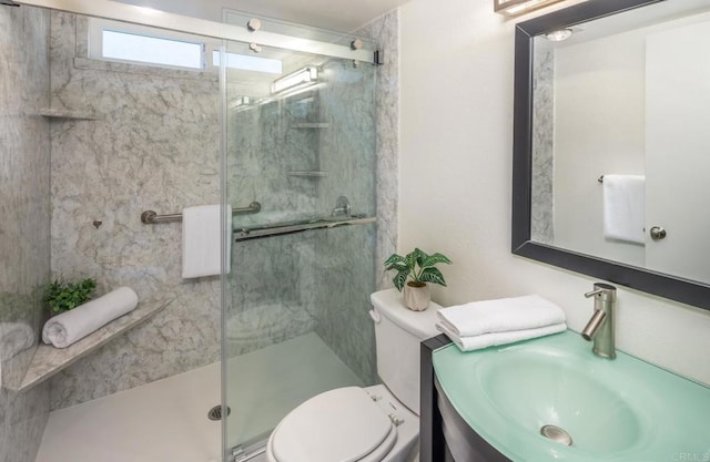 bathroom with an enclosed shower, vanity, and toilet