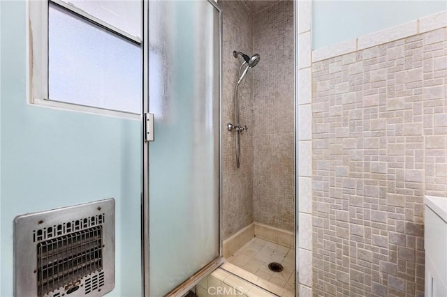 bathroom featuring tile patterned flooring and a shower with door