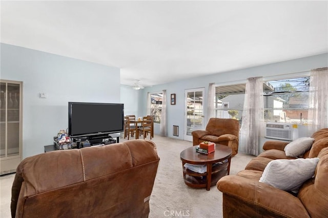 living room featuring carpet, cooling unit, and ceiling fan