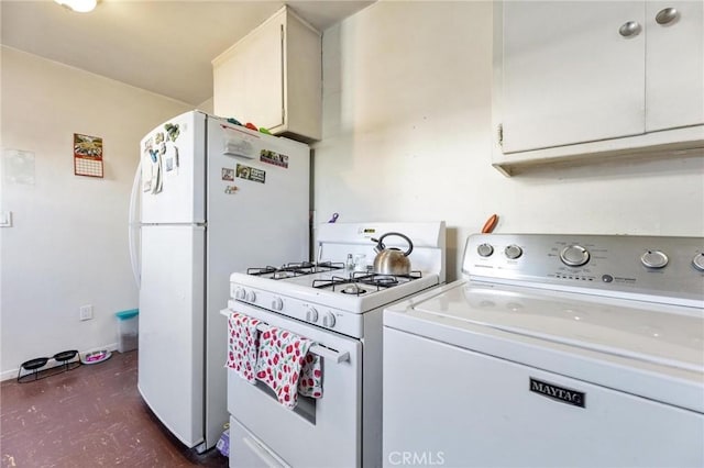 kitchen with washer / dryer, white cabinetry, and white appliances