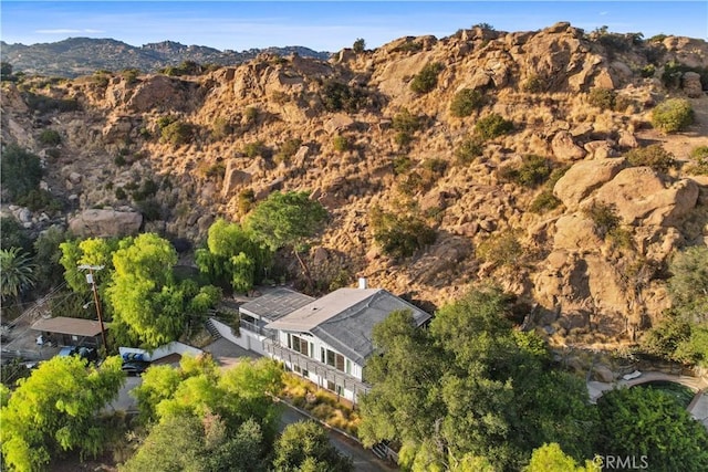 birds eye view of property with a mountain view