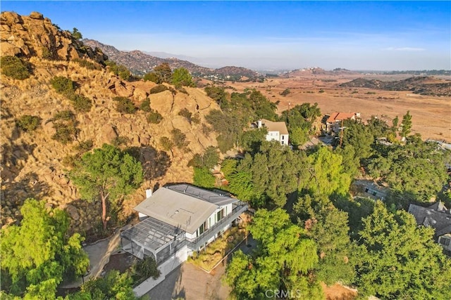 birds eye view of property featuring a mountain view