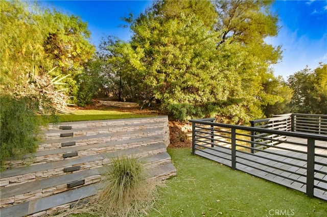 view of gate featuring a wooden deck