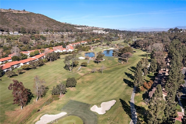 birds eye view of property featuring a water and mountain view