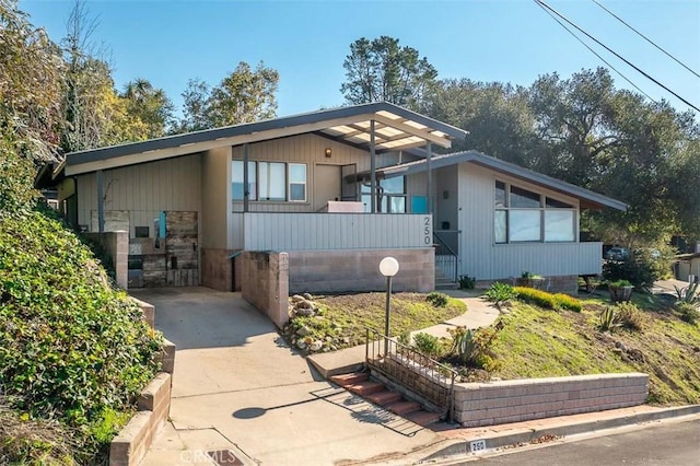 view of front of property with a carport