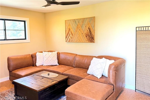 living room featuring ceiling fan and carpet floors