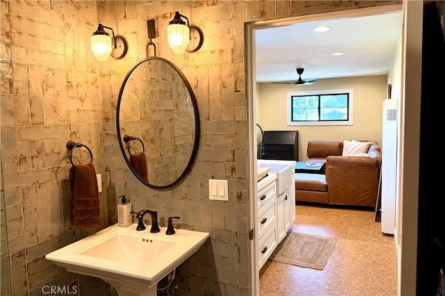 bathroom featuring a ceiling fan and a sink