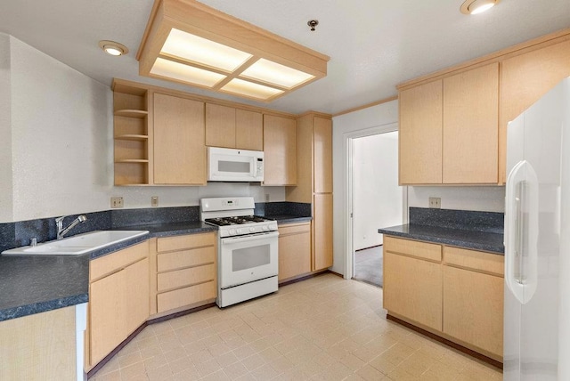 kitchen featuring light brown cabinets, sink, and white appliances