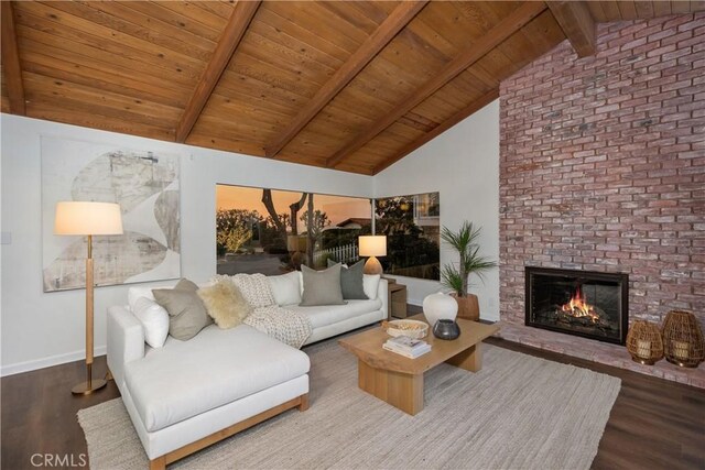 living room featuring wooden ceiling, vaulted ceiling with beams, a fireplace, and hardwood / wood-style flooring