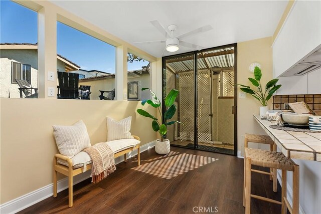 sunroom / solarium with ceiling fan