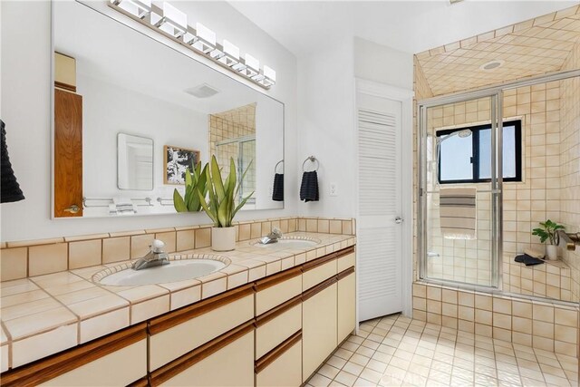 bathroom with vanity and tile patterned flooring