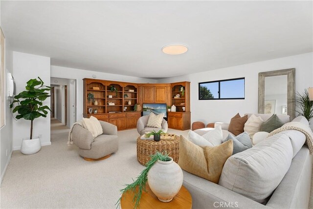 living room featuring light colored carpet