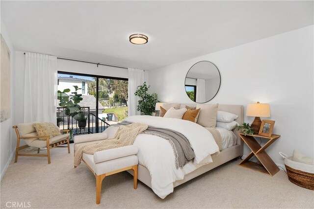 carpeted bedroom featuring access to outside