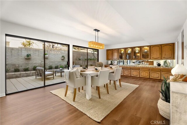 dining room with a wealth of natural light and light hardwood / wood-style floors