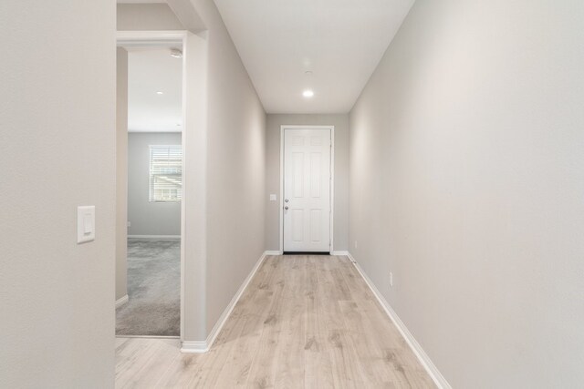 hall with light wood-type flooring