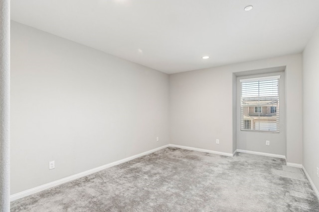 empty room with light colored carpet