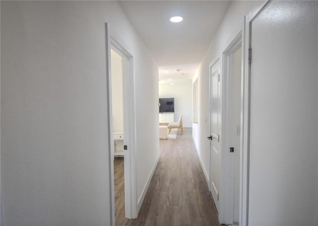 hallway with dark wood-type flooring