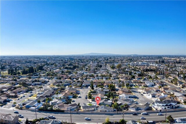 birds eye view of property featuring a mountain view