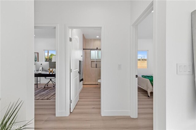 hallway featuring light wood-type flooring