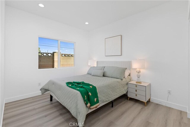 bedroom with light hardwood / wood-style flooring