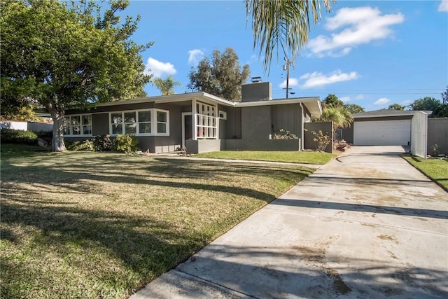 ranch-style house featuring a front lawn and a garage