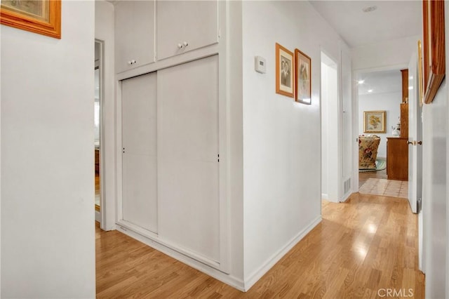 corridor featuring light hardwood / wood-style floors