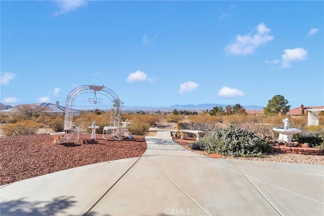 view of patio / terrace featuring a mountain view