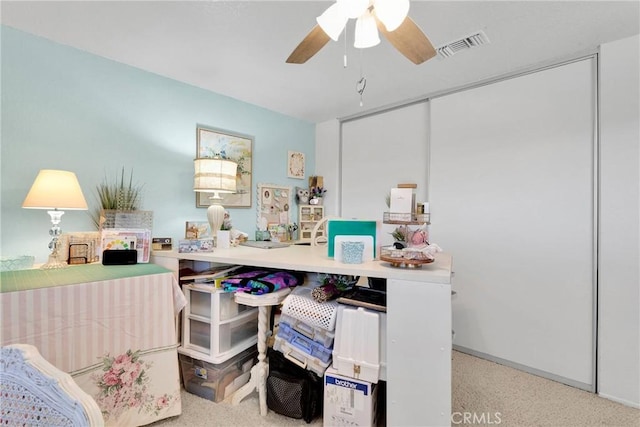 recreation room featuring light carpet and ceiling fan