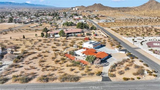 drone / aerial view featuring a mountain view