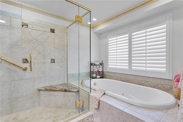 bathroom with crown molding and shower with separate bathtub