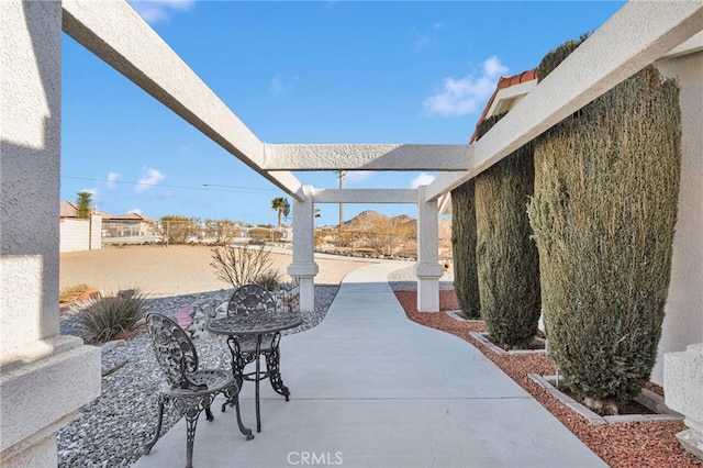 view of patio featuring a pergola