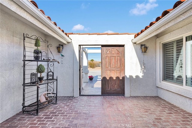 property entrance with a patio area