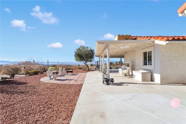 view of patio with a mountain view