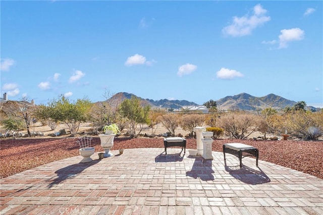 view of patio with a mountain view