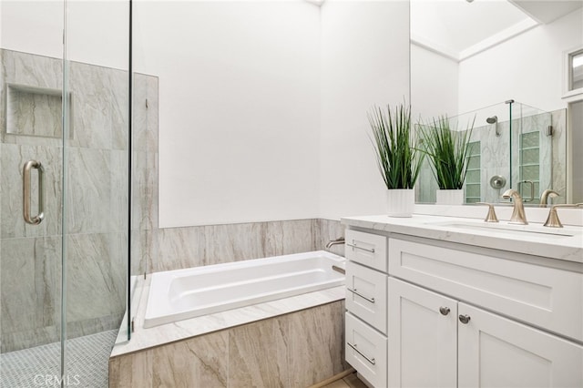 bathroom featuring vanity and shower with separate bathtub